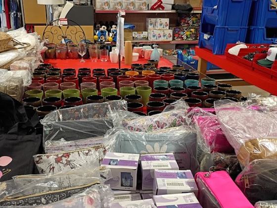 Tables of dollar-aisle finds at Mega Outlet