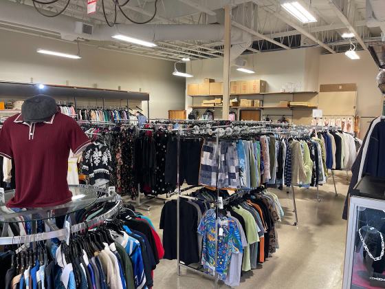 Racks of clothing on the Mega Outlet sales floor