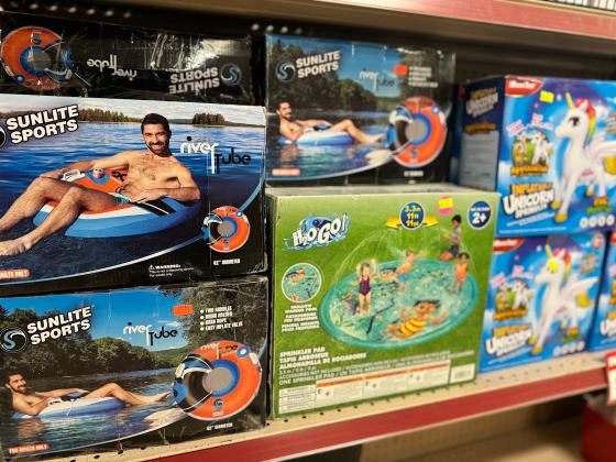 Pool floats and outdoor toys in boxes