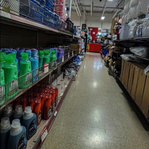 Main aisle stocked floor to ceiling